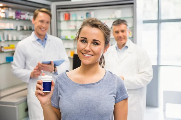 Happy customer holding her medicine — Stock Photo, Image