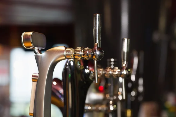 Beer pumps in a row — Stock Photo, Image