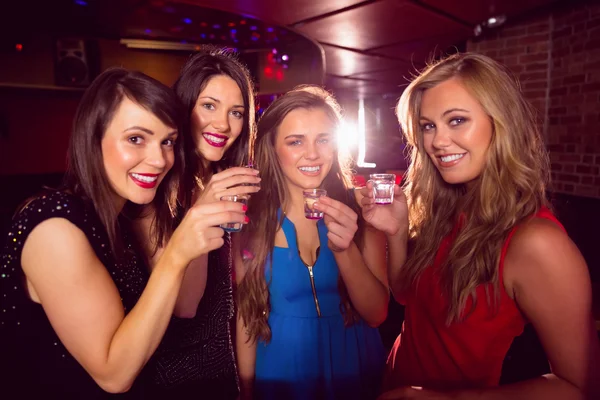 Pretty friends drinking shots together — Stock Photo, Image