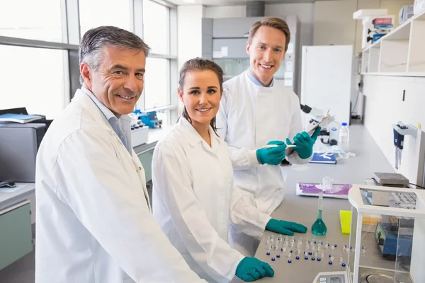 Team of scientists working together — Stock Photo, Image