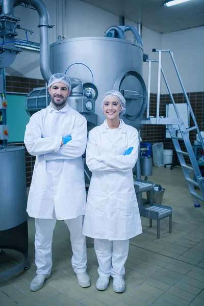 Food technicians smiling at camera — Stock Photo, Image
