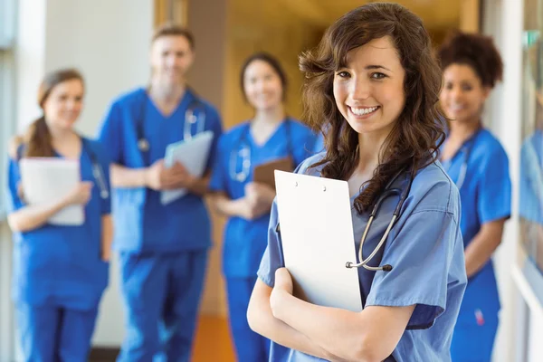 Medical students smiling at the camera — Stock Photo, Image