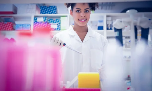 Pretty science student using pipette — Stock Photo, Image