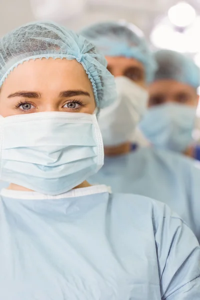 Team of surgeons looking at camera — Stock Photo, Image