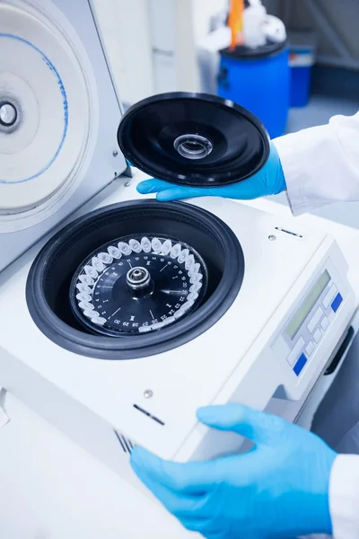 Close up of a chemist using a centrifuge — Stock Photo, Image