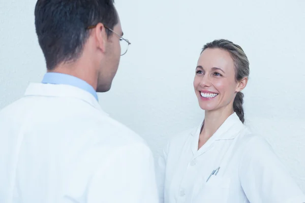 Smiling dentists in discussion — Stock Photo, Image