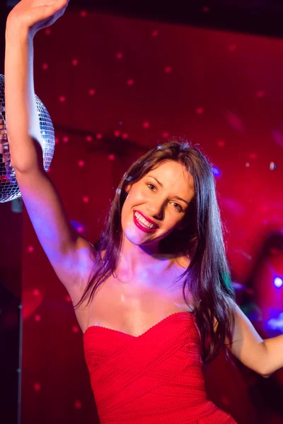 Pretty brunette dancing and smiling — Stock Photo, Image