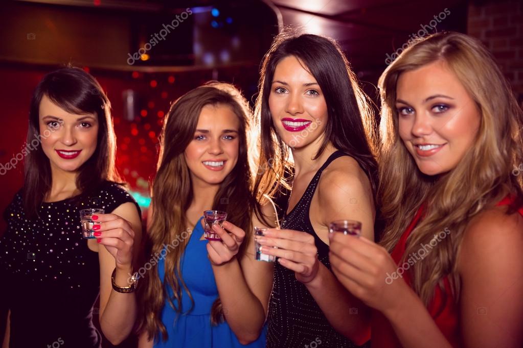 Me And My Friends At The Table Doing Shots Pretty friends drinking shots together Stock Photo by ©Wavebreakmedia