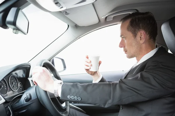 Serious businessman having a coffee — Stock Photo, Image