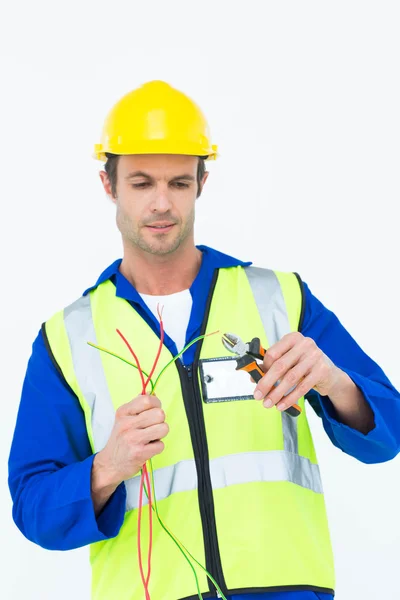 Electrician cutting wire with pliers — Stock Photo, Image