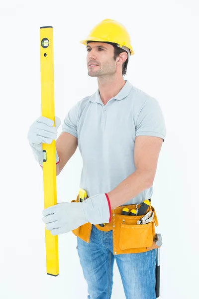 Carpenter using spirit level — Stock Photo, Image