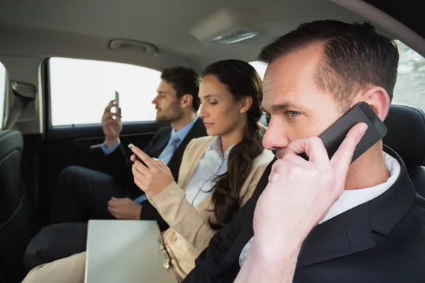 Business team working in the back seat — Stock Photo, Image