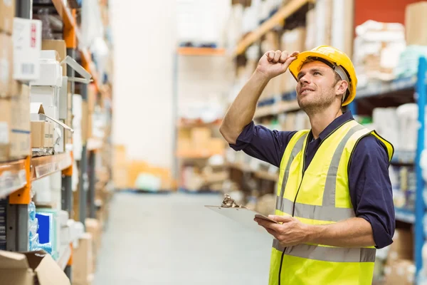 Portrait of warehouse worker with clipboard — Stock Photo, Image