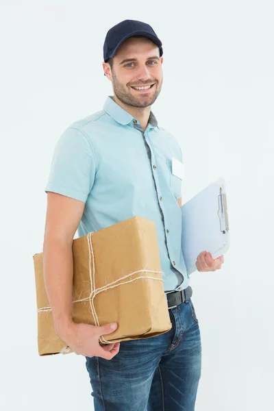 Happy courier man with parcel — Stock Photo, Image
