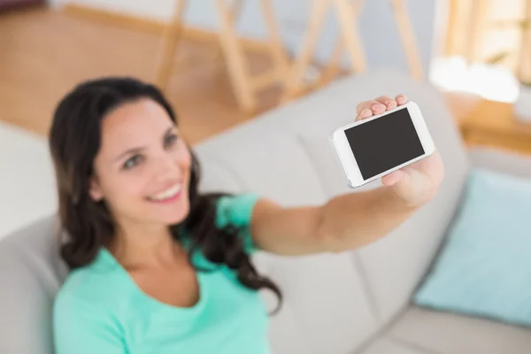 Pretty brunette taking a selfie — Stock Photo, Image