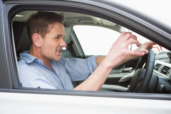 Handsome man experiencing road rage — Stock Photo, Image