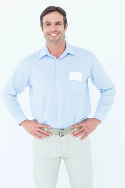 Confident businessman with hands on hip — Stock Photo, Image