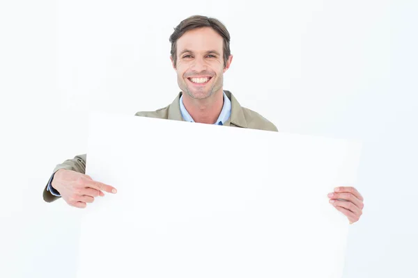 Entrega hombre apuntando a la cartelera en blanco —  Fotos de Stock