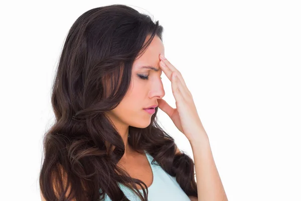 Pretty brunette getting a headache — Stock Photo, Image