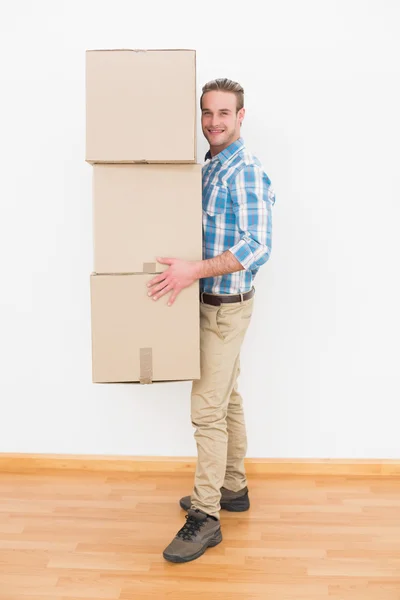 Man carrying cardboard moving boxes — Stock Photo, Image