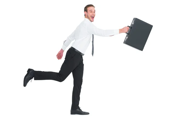 Happy businessman leaping with his briefcase — Stock Photo, Image