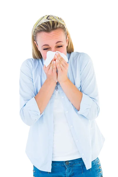 Casual blonde blowing nose on tissue — Stock Photo, Image