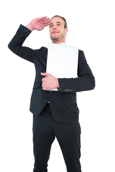 Glimlachend zakenman op zoek en met laptop — Stockfoto