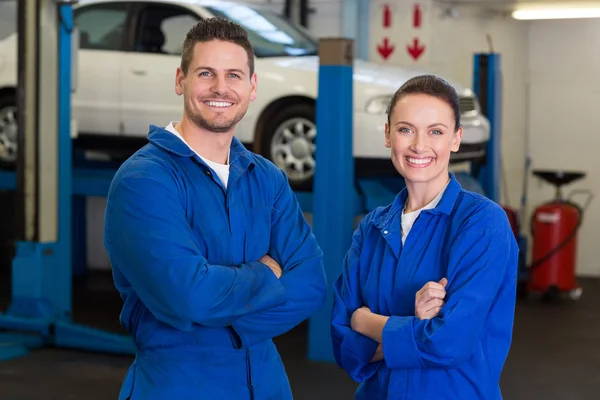 Team of mechanics smiling at camera — Stock Photo, Image