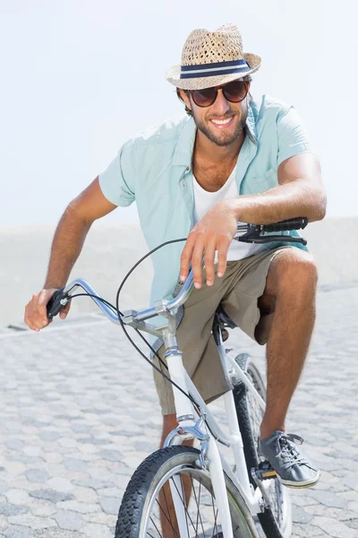 Handsome man on a bike ride — Stock Photo, Image