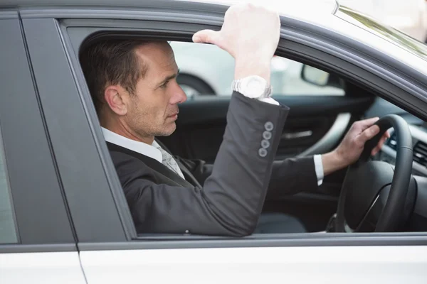 Focused businessman in the drivers seat — Stock Photo, Image