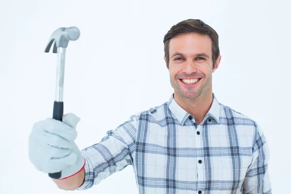 Happy handyman holding hammer — Stock Photo, Image