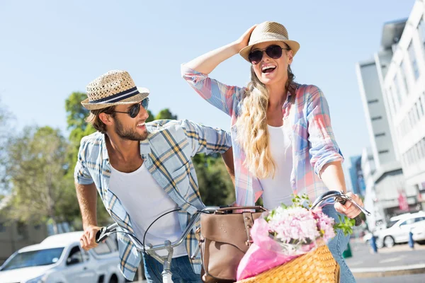 Attractive couple on a bike ride — Stock Photo, Image