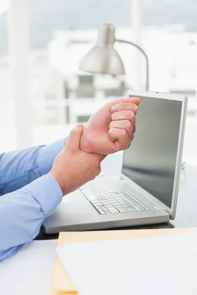 Businessman suffering from wrist pain — Stock Photo, Image