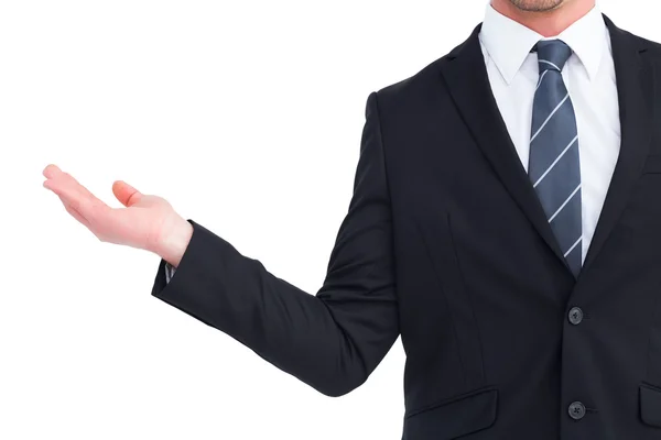 Businessman holding his hand out — Stock Photo, Image