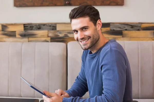 Young man using his tablet pc — Stock Photo, Image
