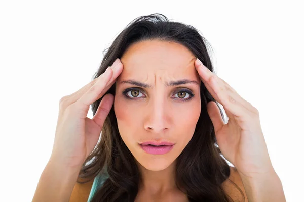 Pretty brunette with a headache — Stock Photo, Image