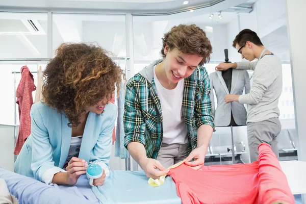 Students working together with a fabric — Stock Photo, Image