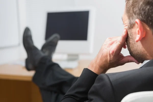 Relaxed businessman with his feet up — Stock Photo, Image