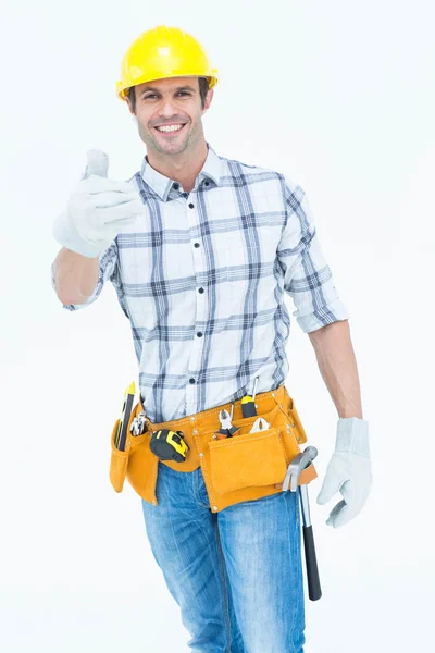 Männlicher Heimwerker gestikuliert Daumen hoch — Stockfoto