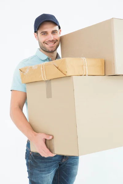 Delivery man carrying cardboard boxes — Stock Photo, Image