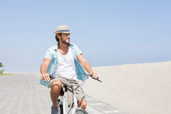 Handsome man on a bike ride — Stock Photo, Image