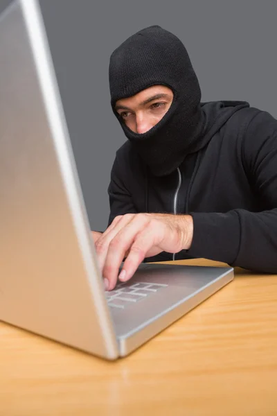 Hacker using laptop to steal identity — Stock Photo, Image