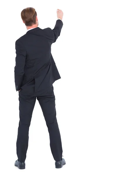 Rear view businessman writing with chalk — Stock Photo, Image