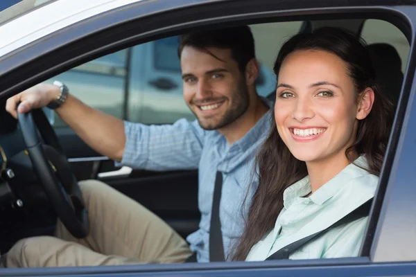 Young couple smiling at the camera Stock Photo