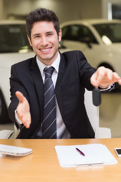 Man giving a customer keys Royalty Free Stock Images