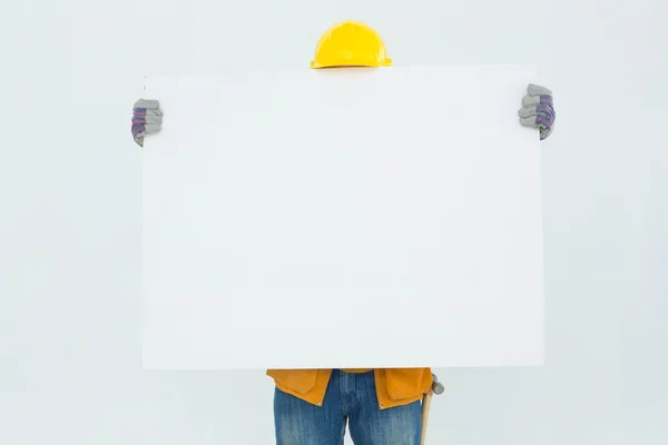 Technicial holding blank billboard — Stock Photo, Image