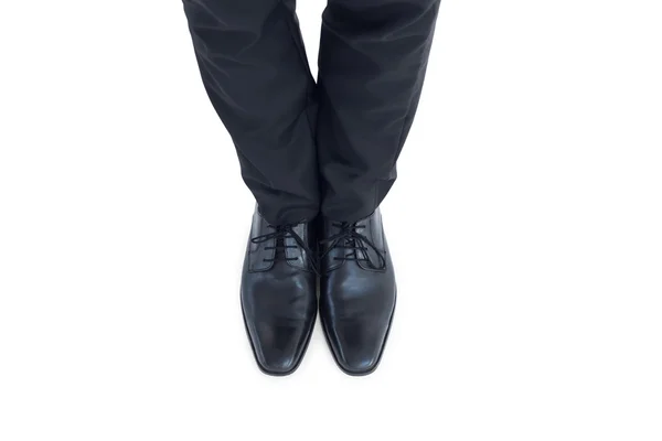 Businessmans feet in black brogues — Stock Photo, Image