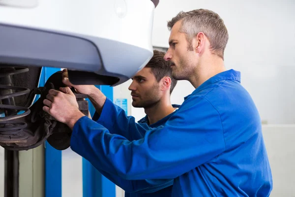 Team of mechanics working together — Stock Photo, Image