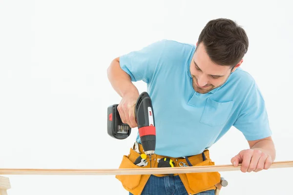 Construction worker using hand drill — Stock Photo, Image