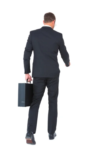 Businessman walking with his briefcase — Stock Photo, Image